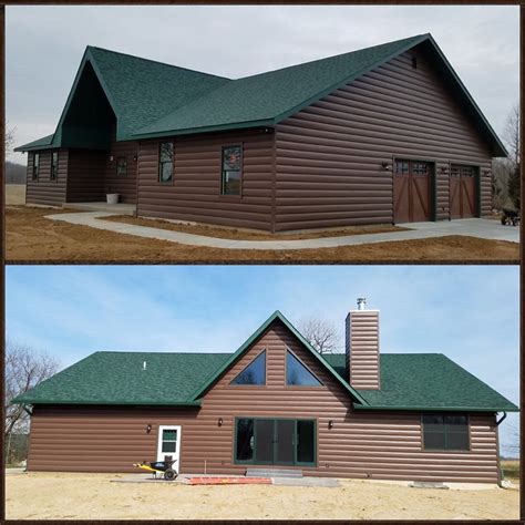 dark brown house with green metal roof|green siding with black trim.